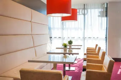 a row of tables and chairs in a waiting room at Hotel Dream in Sofia