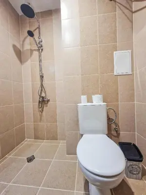 a bathroom with a toilet and a shower at Cozy 2BD Apartment in Bansko by Flat Mаnager in Bansko