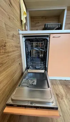 a dishwasher with its door open in a room at Rio Sunny 2BDR Apt near NDK - Metro - non-stop paid public Parking in Sofia