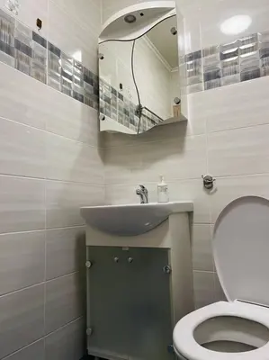 a bathroom with a sink and a toilet and a mirror at Little Jack With Terrace in Sofia